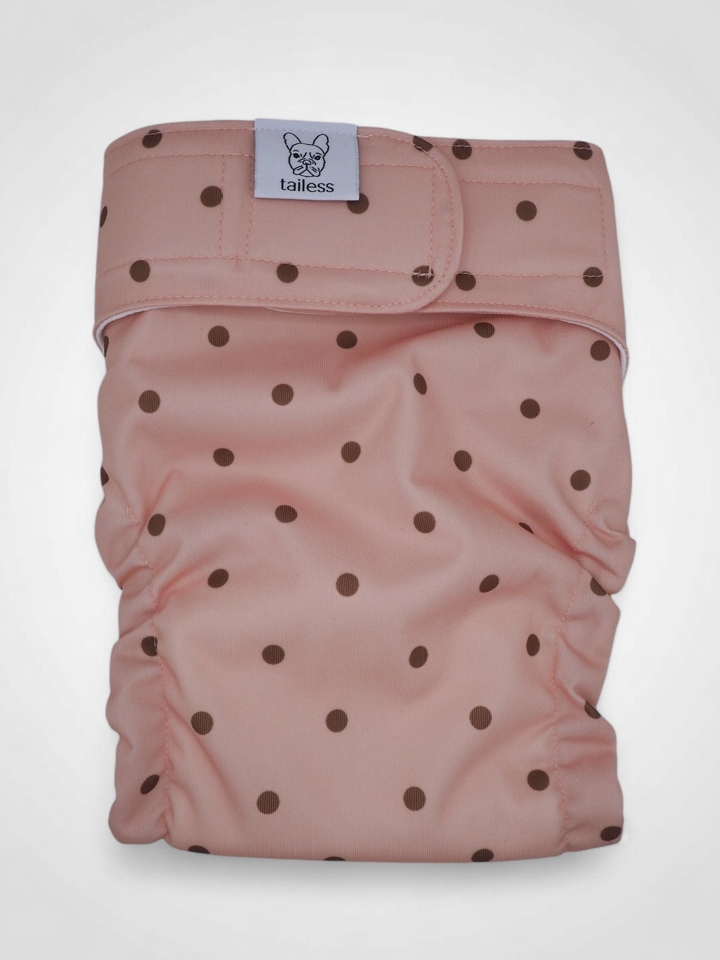 Absorbent and washable heat pants for tailless dogs.